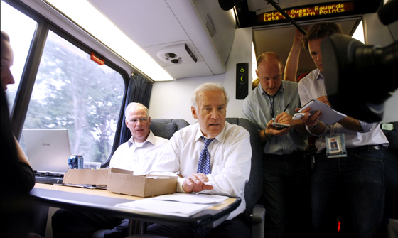 Then Sen. Joe Biden (D-Del) mingles with passengers aboard the Amtrak Acela train. (AP file photo/Gerald Herbert)